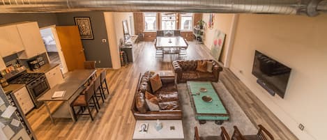 Looking down at the main living space and kitchen from the penthouse skylight of