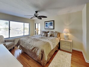 Primary Bedroom - King-Size Bed, TV, Balcony Access and En Suite Bathroom