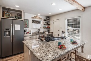 Gourmet Greatness - Upgraded appliances, granite countertops, and a huge breakfast bar/kitchen island make the kitchen a pleasure to work in.