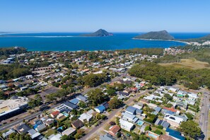 Walk 1km to Shoal Bay Beach. Safest swimming area near wharf.
