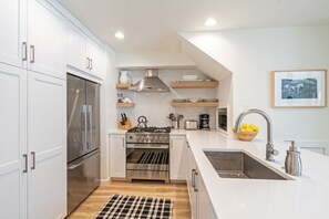 Newly remodeled kitchen with shiny new appliances.