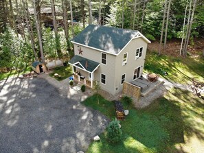 Cascade Mountain Chalet is a 3 bedroom, 2 bath home set on an acre of property surrounded by trees.