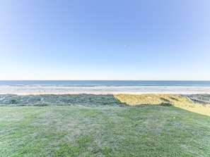 Why Can’t Every Beach be as Beautiful and Unspoiled as this? - Sand Dollar II 207 is just up the path from the beach, sleeps six, and is a perfect beach vacation rental. Spend countless hours basking in the sun and playing in the surf.