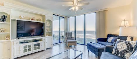 The Atlantic Ocean is just yards away from Sand Dollar II 207! - In this second-floor condo, you have sweeping views of the beach and sea, horizon and sky. The living area is flooded with light and has access to the oceanfront lanai.