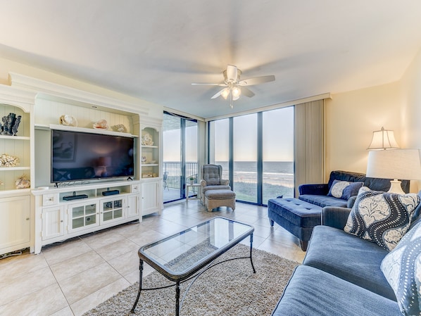 The Atlantic Ocean is just yards away from Sand Dollar II 207! - In this second-floor condo, you have sweeping views of the beach and sea, horizon and sky. The living area is flooded with light and has access to the oceanfront lanai.