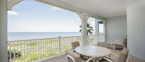 Dine Alfresco on the Spacious Covered Balcony - Breathtaking ocean views and balmy sea breezes add zest to any meal.