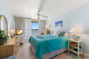 Primary Bedroom- Bay Views + Balcony Access