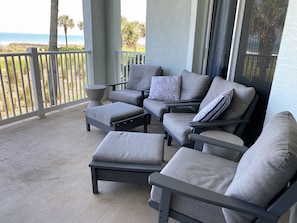 Unparalleled Beauty at 622 Cinnamon Beach! - Step out through the sliding glass doors and witness the beauty just beyond your balcony, with crystal blue skies and swaying palms.