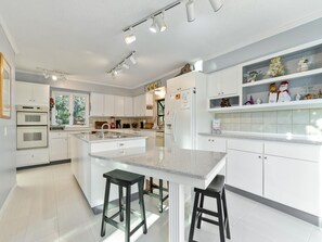 Fully Equipped Kitchen with a Breakfast Bar for Seating for Two