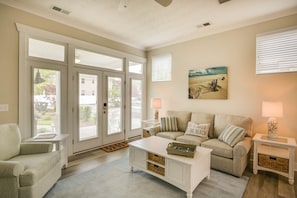 Spacious living space with 50 inch flat screen TV and board games.