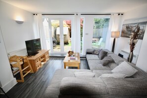 Open plan lounge that leads to the garden area