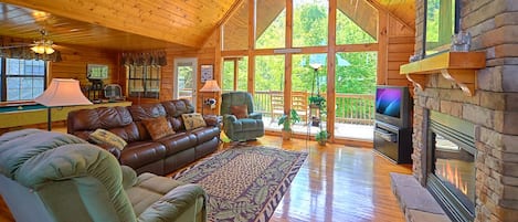 Welcome to your home away from home - With its vaulted ceiling, comfortable seating (including 2 plush recliners), gas fireplace, and oversized windows looking out toward the woods, African Safari’s living area truly is a great room for relaxing.