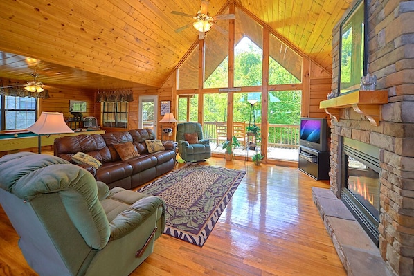 Welcome to your home away from home - With its vaulted ceiling, comfortable seating (including 2 plush recliners), gas fireplace, and oversized windows looking out toward the woods, African Safari’s living area truly is a great room for relaxing.
