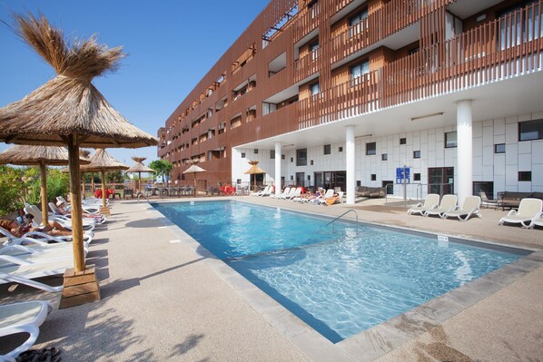 Go for a dip in the lovely outdoor pool.