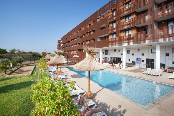 Take in gorgeous views while lounging around the on-site outdoor pool.