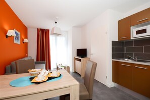 Prepare a meal in the equipped kitchen.