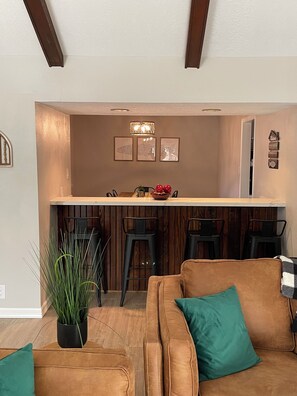 Bar with seating for four. 