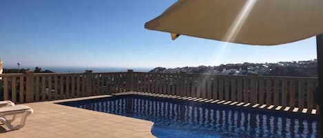 Beautiful view from the terrace across the pool and out to sea 