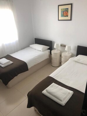 Twin bedroom one. All bedrooms have built in wardrobes and underfloor heating