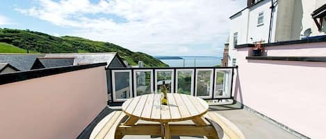 sunny roof terrace with sea views