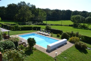 Swimming pool and field belonging to house