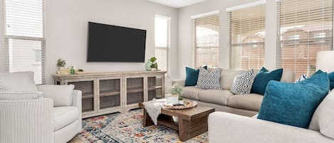 Family room featuring large flat screen tv and comfortable seating