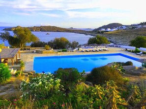 Olympic size pool for the residents with  pool bar, sunbeds, with sea view