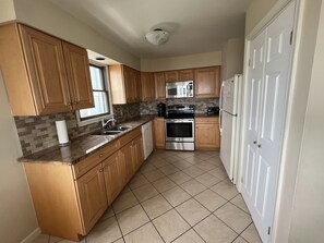 Updated Granite & Stainless Steel Kitchen