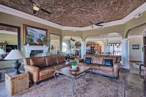 Looking into the grand room from the patio. Living, dining, 2nd sitting area