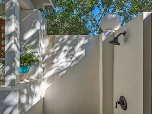 Outdoor shower upon entry to courtyard