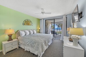 Primary Bedroom with a King Size Bed and Private Balcony Access