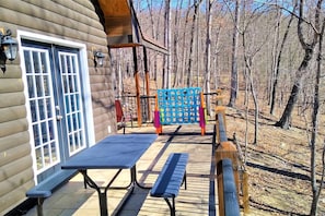 Wrap around balcony with picnic table, huge Connect-4 game and gas bbq grill.