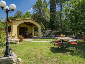 Plant, Building, Table, Shade, Sky, Tree, Land Lot, Outdoor Furniture, Grass, Leisure