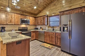 Nice open kitchen with stainless appliances, granite counters, and fully stocked