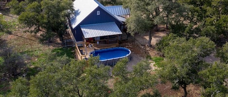 Aerial view of home with Private pool, covered deck and spa.