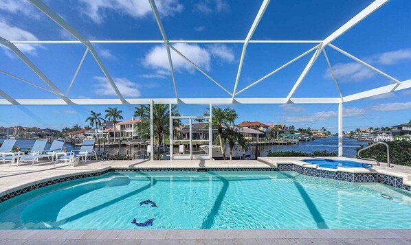 Oversized Pool with Hot Tub and Picture Window of Intersecting Canals