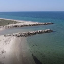 Assoc. Beach with Shallow Area Between the Two Jetties Ideal for Small Children