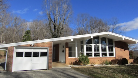 Pulling up to front of lovely Swiss chalet style house!