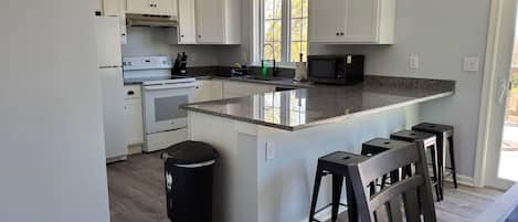 Newly Renovated kitchen.  Fully stocked with pots/pans and dishes.