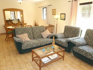Furniture, Room, Living Room, Property, Floor, Interior Design, Building, Coffee Table, Couch, Table
