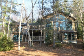 Rear of home with lakeside view

