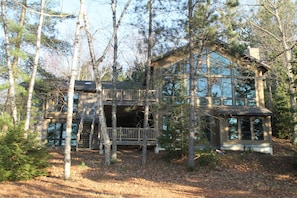 Rear of home with lakeside view
