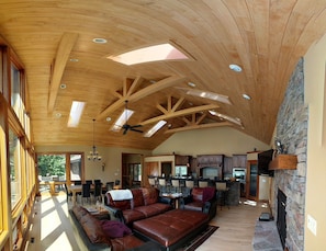 Great Room / Kitchen with stone faced gas fireplace
