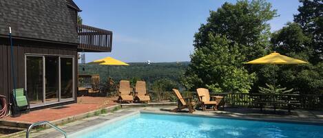 Pool, house, and river below