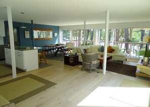 Open living area with living/TV area, dining area and kitchen.