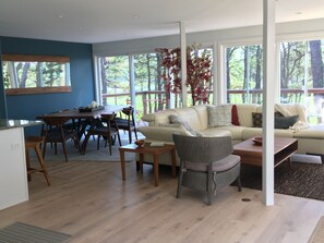Living/Dining areas.  View of marsh and 2 sliders to front deck.