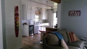 Open concept kitchen/LR - kitchen is roomy for cooking w/views of lake!