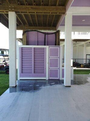 Outside shower and bathroom with door and door lock