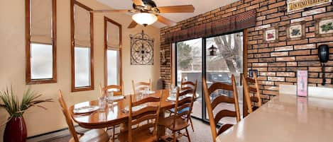 Dining room, bar and patio door leading to back deck (fan is not functional)