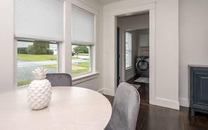 dining area looking out to entrance with laundry area